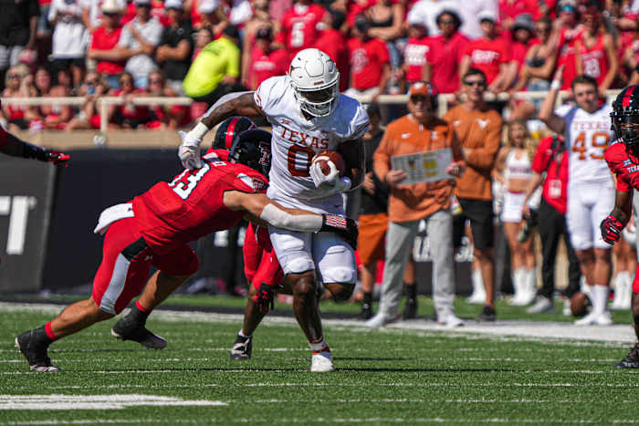 Sep 24, 2022; Lubbock, Texas, USA; Texas Longhorns tight end Ja'Tavion Sanders is tackled by Texas Tech Red Raiders linebacker Jacob Rodriguez (13) during a game at Jones AT&T Stadium.